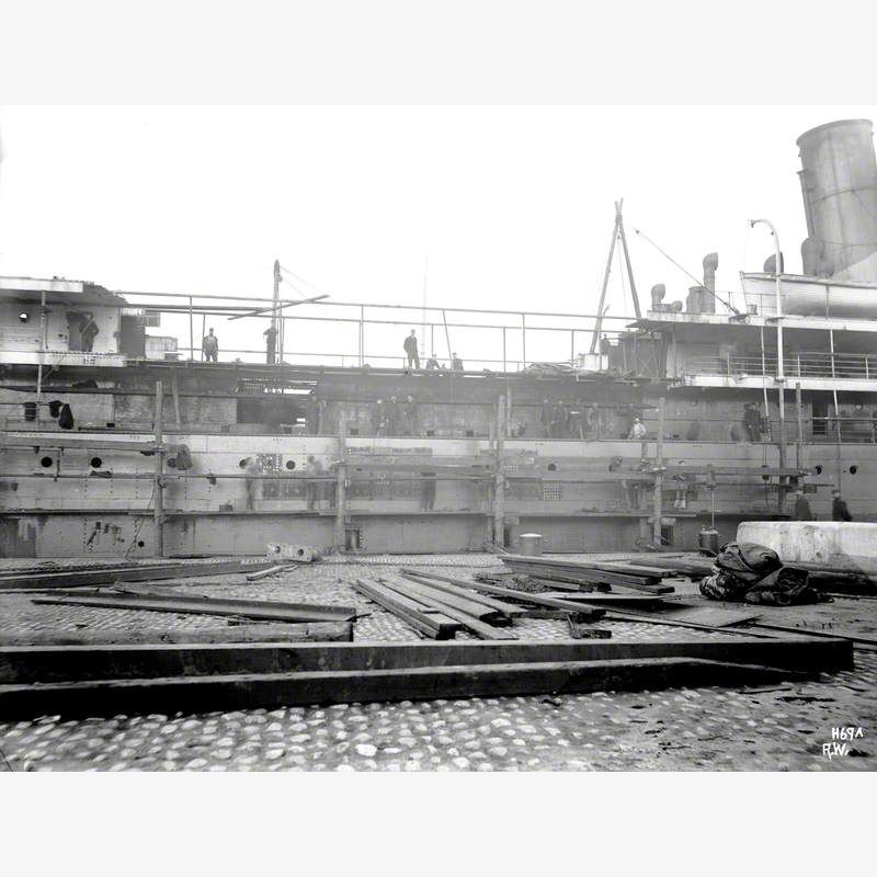 Profile view from dock side of seperated hulls, with newly constructed hull insertion