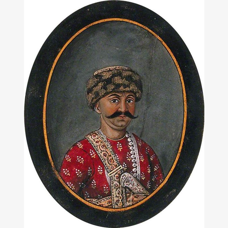 Hassan Raza Khan Wearing a Woollen Cap and a Red Attire