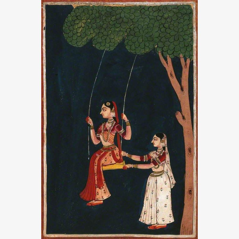 An Indian Lady on a Swing Being Pushed by Another Indian Woman