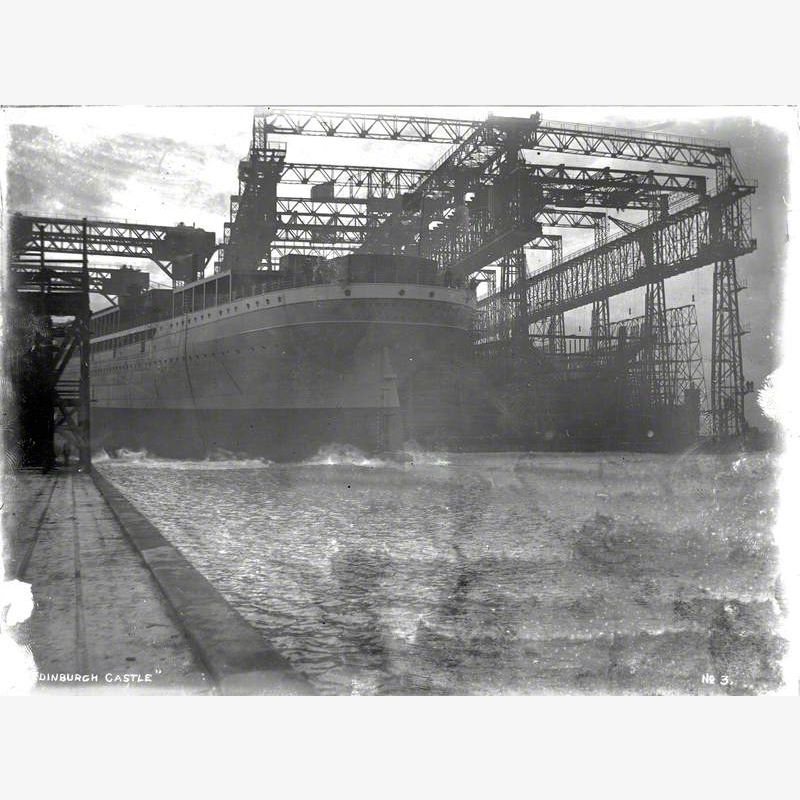 Launch; port stern view of hull entering water